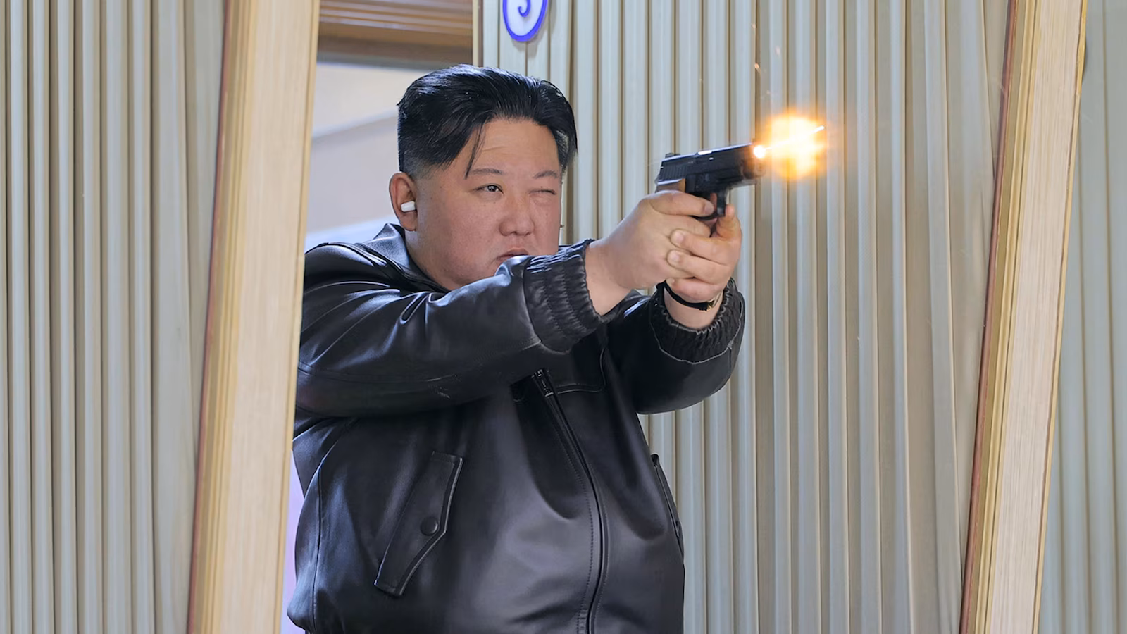 North Korean leader Kim and his daughter try out new pistols at a shooting range