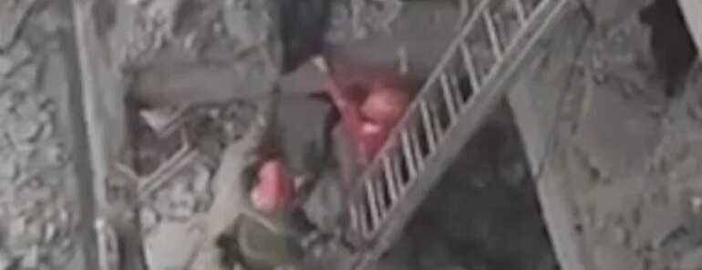 Rescue workers search for debris after an airstrike in Tehran